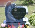 Shown here is a picture of a heart shaped monument with an angel sculpture. Call the Tedesco's Gizzie Memorials at 818-333-2444 for prices and to order this type of cemetery memorial.