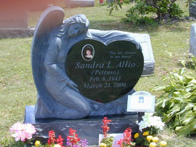 Shown here is a picture of a heart shaped monument with an angel sculpture. Call the Tedesco's Gizzie Memorials at 818-333-2444 for prices and to order this type of cemetery memorial.